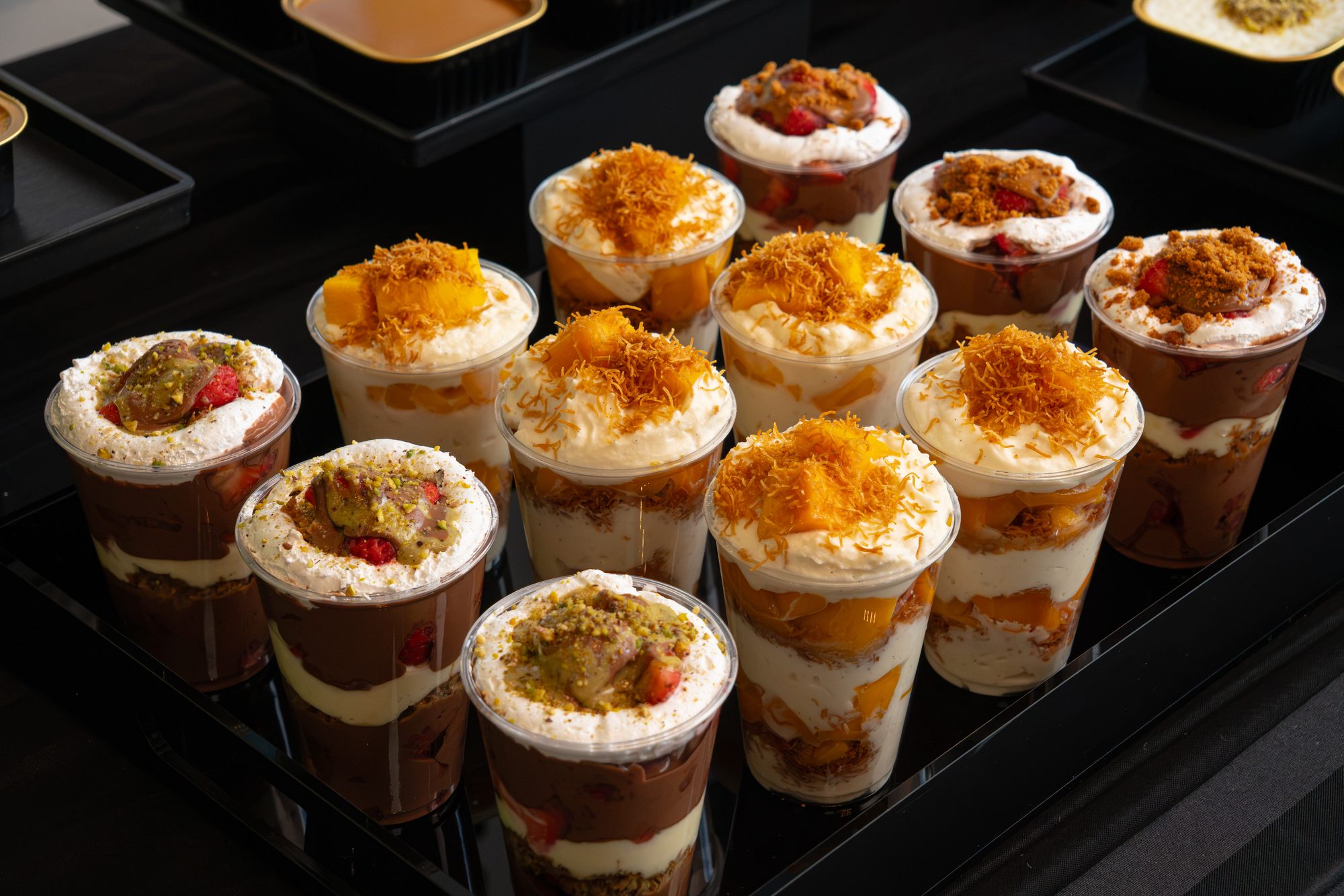 A set of layered dessert cups photographed from above